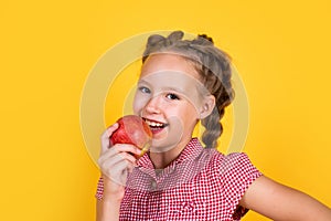 Happy teen child with apples full of vitamin picked from autumn harvest, dieting