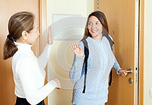 Happy teen daughter smiling and say goodbye