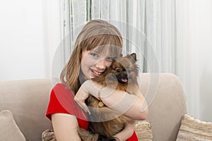 Happy teen with dog. Portrait girl with pet