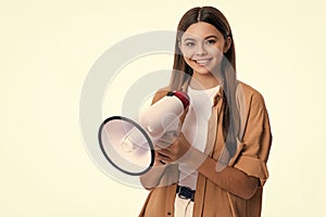 happy teen girl announcer with loudspeaker isolated on white. teen girl announcer hold loudspeaker