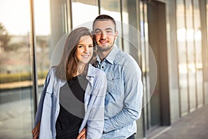 Happy teen girl and boy having good fun time outdoors. Selective