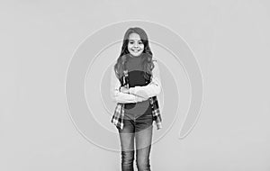 happy teen girl in casual clothes on yellow background, teeny