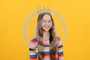 happy teen girl in crown. self confident queen. expressing smug. arrogant princess in tiara.