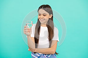 happy teen girl drink glass of water to stay hydrated and keep daily water balance, daily water.