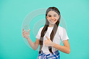happy teen girl drink water keep daily water balance in body show thumb up, daily water.