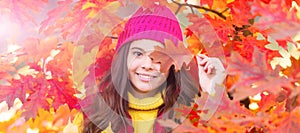 happy teen girl in hat with autumn colorful oak tree leaves, fall. Autumn fall child for poster design. Banner header