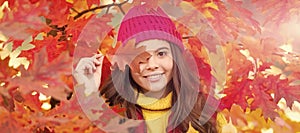 happy teen girl in hat with autumn colorful oak tree leaves, fall. Autumn fall child for poster design. Banner header