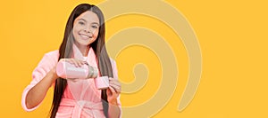 happy teen girl in home terry bathrobe with thermos bottle, water balance. Horizontal poster of isolated child face