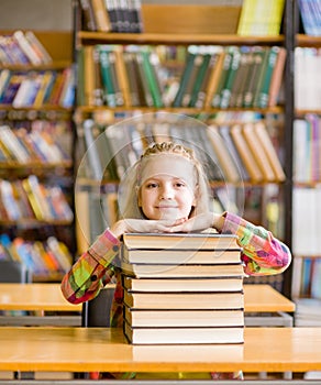 Happy teen girl in library