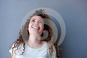 Happy teen girl smiling and looking up