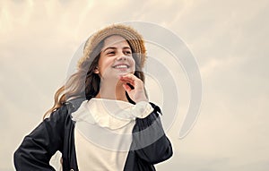 happy teen girl smiling outdoor. happy childhood. pretty child on sky background.
