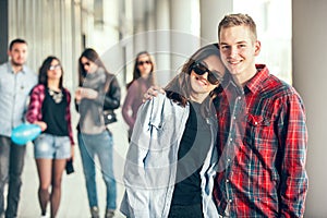 Happy teen girls and boys having good fun time outdoors.