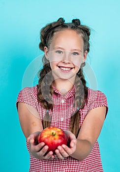 happy teen kid with apples full of vitamin picked from autumn harvest, autumn