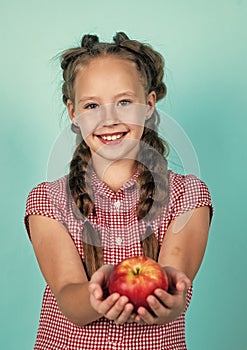 happy teen kid with apples full of vitamin picked from autumn harvest, autumn