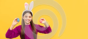 happy teen kid in bunny ears with painted eggs for easter, egg hunt. Easter child horizontal poster. Web banner header