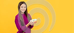 happy teen kid with painted quail eggs for easter, egg hunt. Easter child horizontal poster. Web banner header of bunny