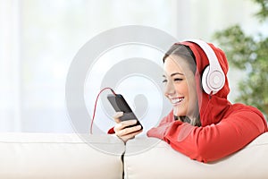 Happy teen listening music from phone