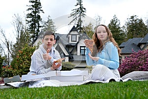 a Happy teen students boy and a girl laughing on a lunch break at school. Selective focus