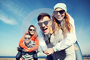 Happy teenage friends having fun outdoors