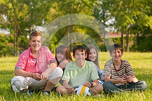 Happy teenage friends having fun in the park