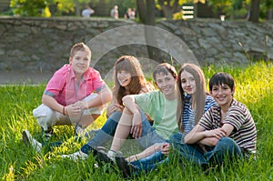 Happy teenage friends having fun in the park