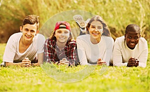 Happy teenage friends in park