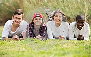 Happy teenage friends in park