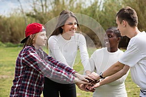 Happy teenage friends in park