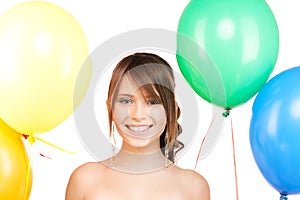 Happy teenage girl with balloons