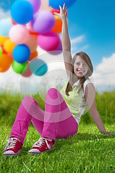 Happy teenage girl with balloons