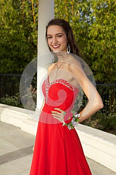 Happy Teenage Girl Going to the Prom in a Red Dress