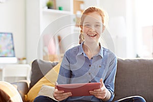 Happy Teenage Girl Holding Tablet