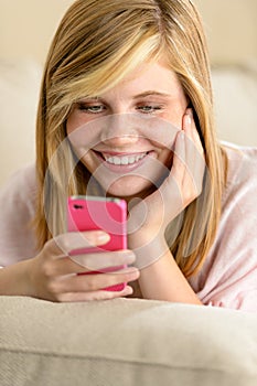 Happy teenage girl in love receive SMS photo