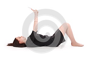 Happy teenage girl lying on the floor with tablet pc