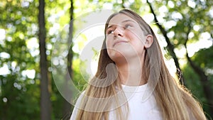 happy teenage girl portrait in the park. teenager wants a dream portrait at sunset. woman daughter silhouette dreams a