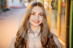 happy teenage girl portrait in the street. teenage girl portrait outdoor.