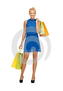 Happy teenage girl with shopping bags