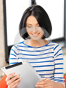 Happy teenage girl with tablet pc computer