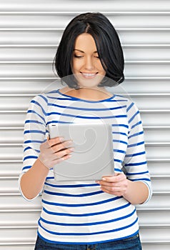 Happy teenage girl with tablet pc computer