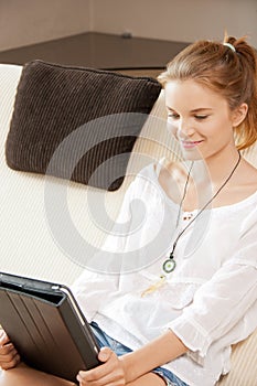 Happy teenage girl with tablet pc computer