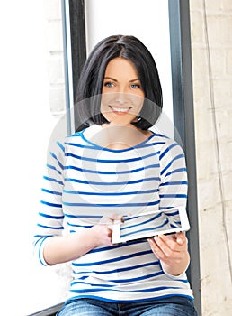 Happy teenage girl with tablet pc computer