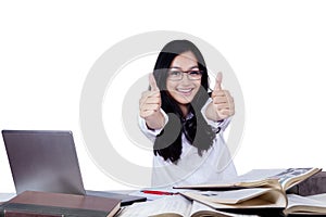 Happy teenage student with thumbs up