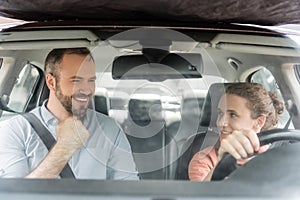 happy teenager boy holding steering wheel