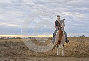 Happy teenager boy with horse