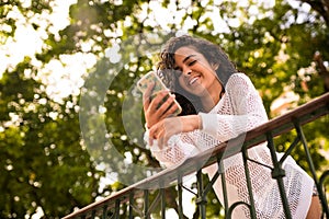 Happy teenager with cellphone in hand