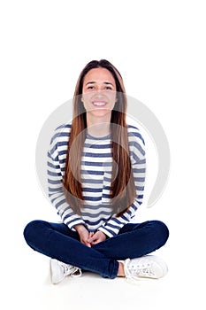 Happy teenager girl sitting on the floor