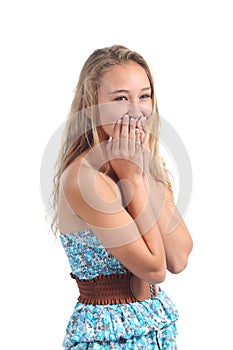 Happy teenager laughing timidity covering her mouth with the hands
