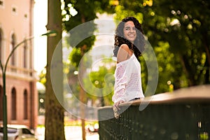 Happy teenager in park gazebo