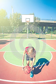 Happy teenager play basketball outdoor healthy sporty teenagers lifestyle concept in spring or summer time