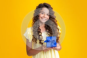 Happy teenager portrait. Cute teenager child girl congratulate with valentines day, giving romantic gift box. Present